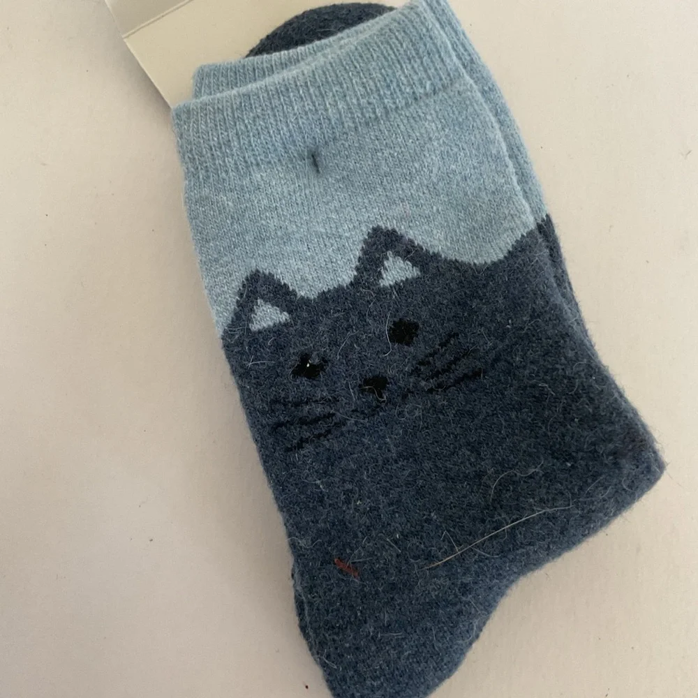 Wool socks with cat graphics. NWT
